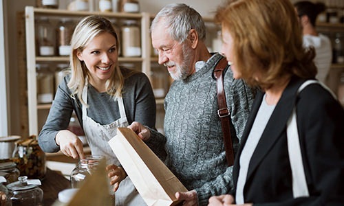 man and two woman at a store